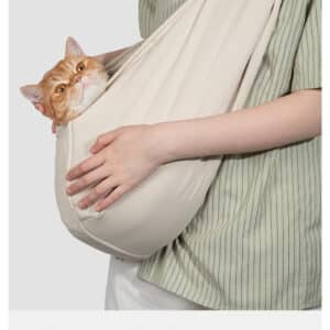 Comfortable sling carrier for cats up to 9 kg, perfect for stylish pet transportation.