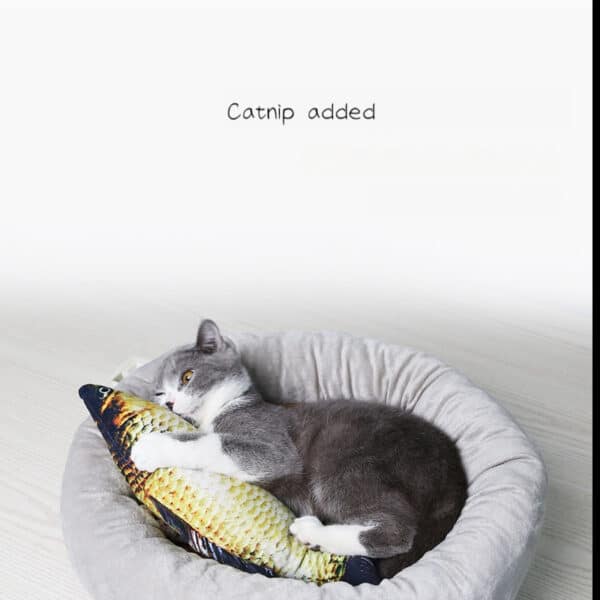 Gray and white cat napping on catnip pillow in a cozy plush bed.