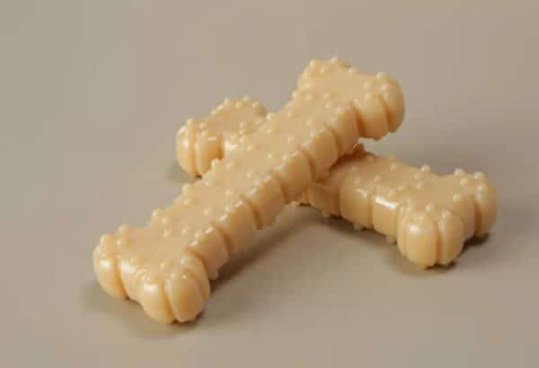 Bone-shaped dog treats in beige, perfect for tasty rewards and happy pups.