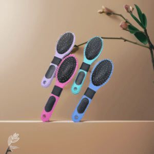 Colorful hairbrushes with floral accents, arranged beautifully against a warm peach background.