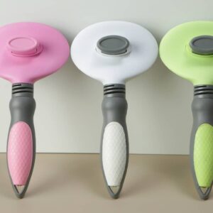 Vibrant ergonomic kitchen tools in pink, white, and green, showcasing modern design and style.