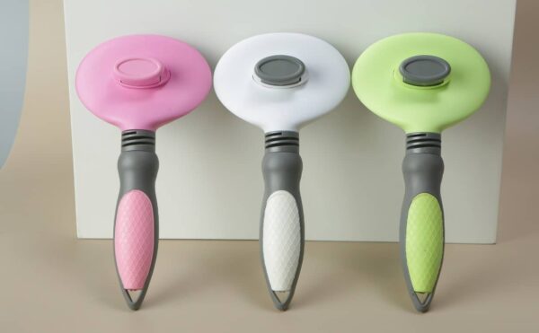 Vibrant ergonomic kitchen tools in pink, white, and green, showcasing modern design and style.