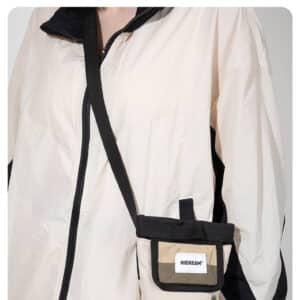 Sporty cream jacket and detachable pocket bag by HICORY for trendy casual wear.