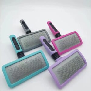 Vibrant pastel pet grooming brushes with ergonomic handles for effective and stylish grooming.