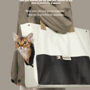 Chic mobile cat carrier for adventures, featuring a playful cat and stylish design.