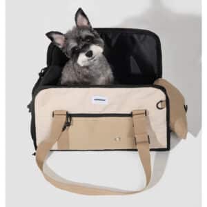 Sleek travel bag for parents, doubling as a pet carrier with an adorable dog inside.